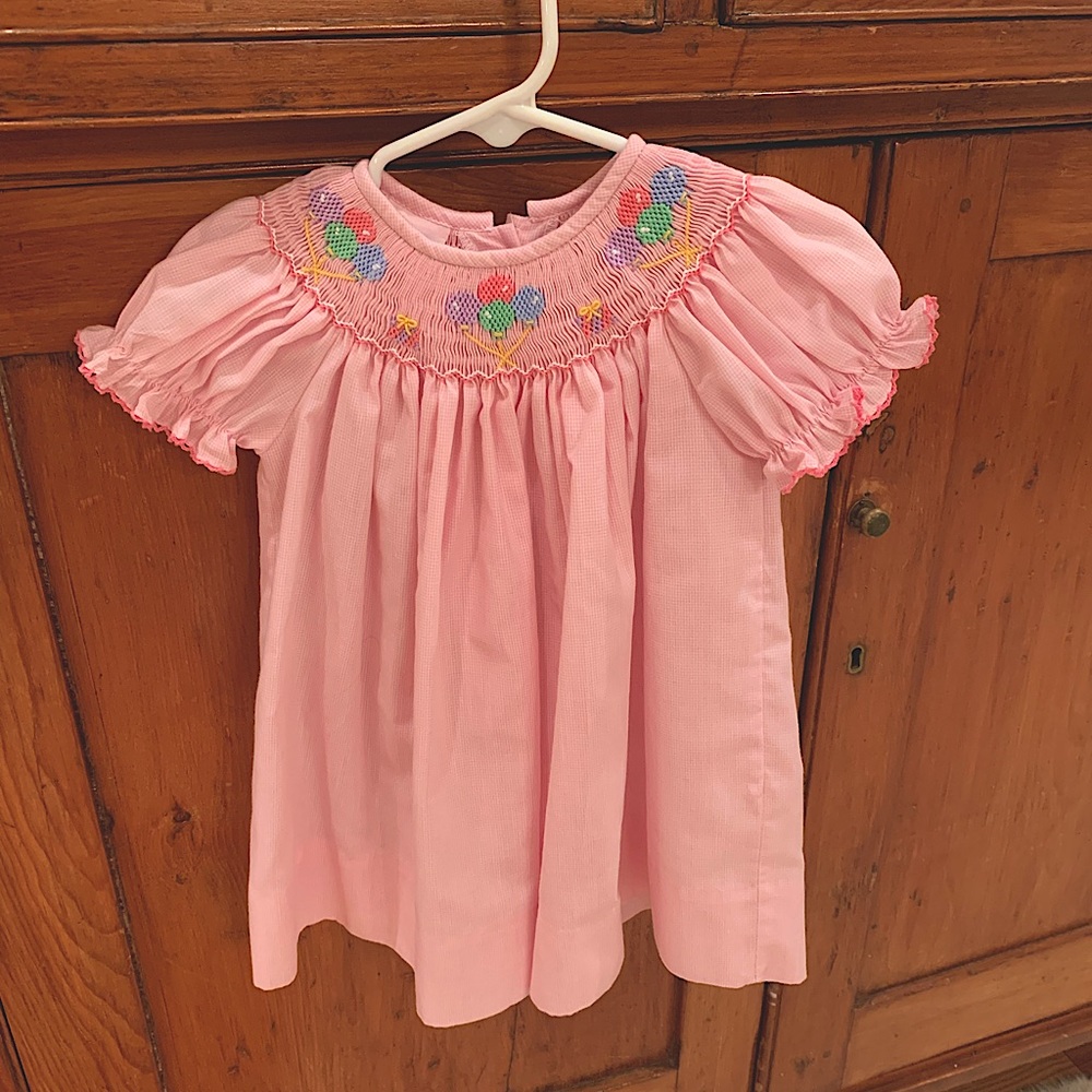 Pink birthday dress with smocked balloons
